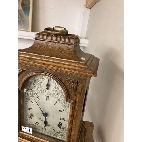 1138 - An oak cased mantel clock with silvered dial, COLLECT ONLY.