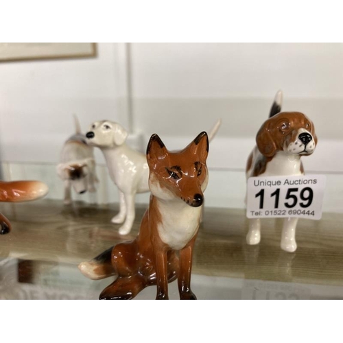 1159 - Three Beswick hounds & Two Beswick foxes