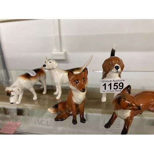 1159 - Three Beswick hounds & Two Beswick foxes