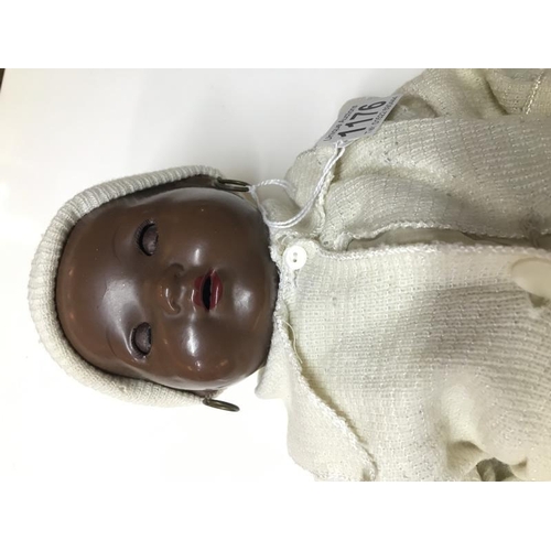 1176 - A vintage British made black baby doll (hands a/f).