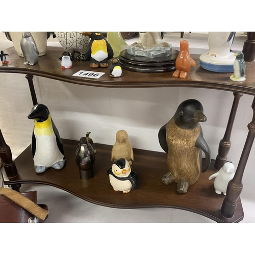 1496 - A collection of penguin figures, pottery, china, wood etc