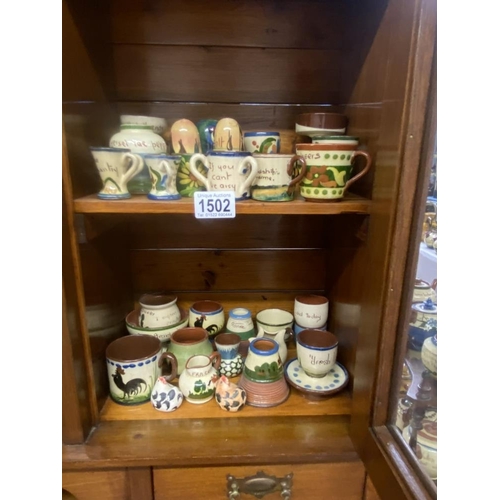 1502 - A quantity of Torquay ware including salts, match striker etc