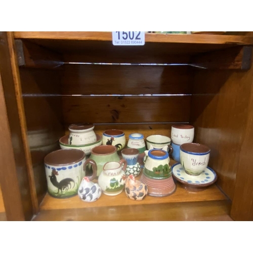 1502 - A quantity of Torquay ware including salts, match striker etc