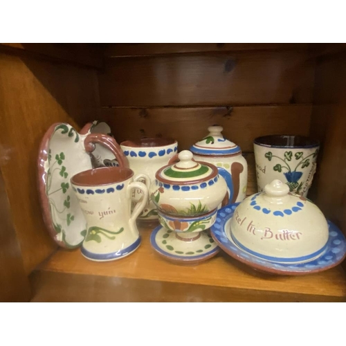 1504 - A quantity of Torquay ware including butter dish, sugar bowls etc