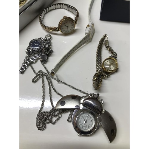 1460J - Eight ladies wrist watches and a pendant watch.