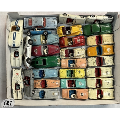 587 - A good lot of 1950s Dinky Sports cars including Triumph, Austin Healey, Aston Martin, MG etc