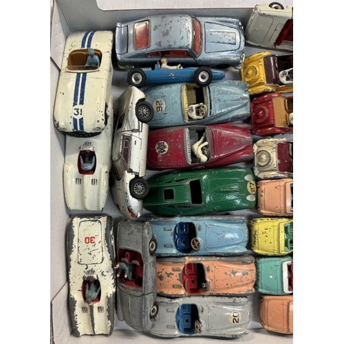 587 - A good lot of 1950s Dinky Sports cars including Triumph, Austin Healey, Aston Martin, MG etc