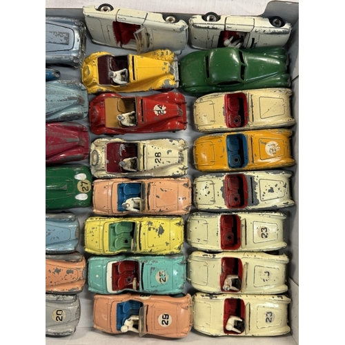 587 - A good lot of 1950s Dinky Sports cars including Triumph, Austin Healey, Aston Martin, MG etc