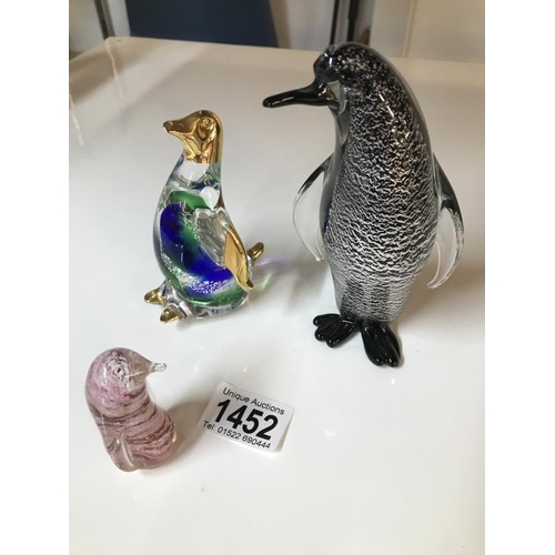 1452 - Two glass penguins & a sand filled penguin etc