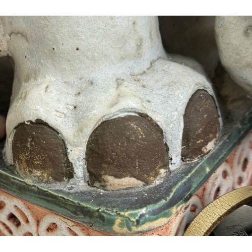 1498 - A late 19th/early 20th century ceramic elephant garden seat/pot stand