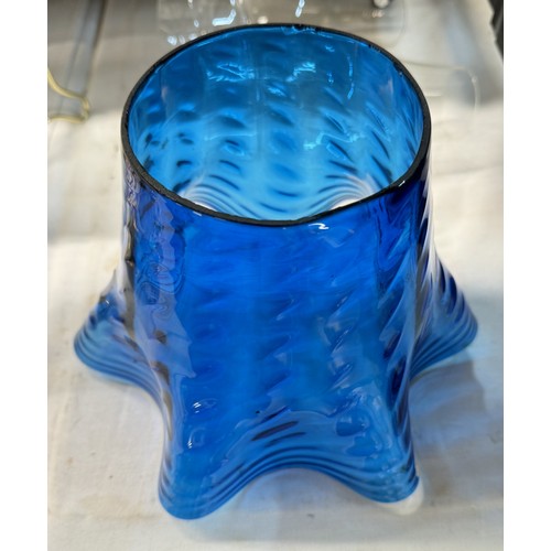 1478 - A blue glass oil lamp shade and 2 chimneys