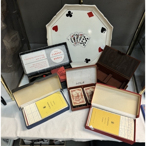 411 - A vintage playing card drinks tray, various card games & carpet bowls