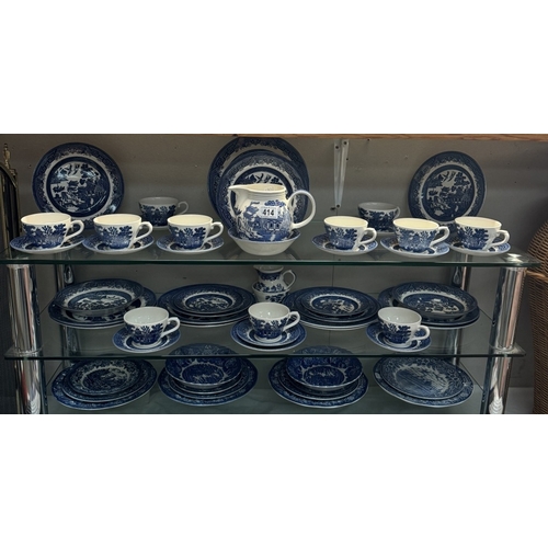 414 - A blue & white willow pattern dinner set by Churchill & A quantity of other blue & white dinner plat... 