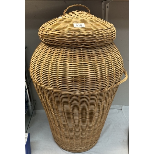 418 - A large Ali-Baba style wicker laundry basket