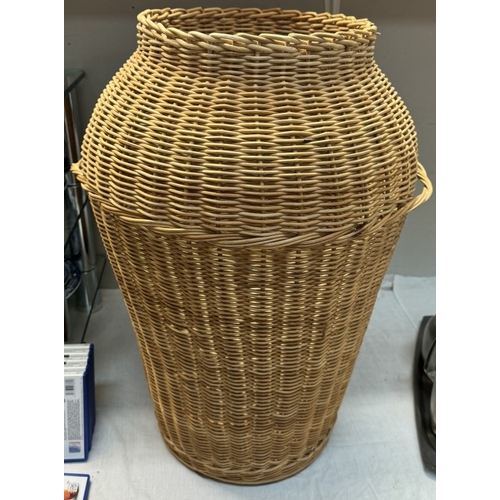 418 - A large Ali-Baba style wicker laundry basket