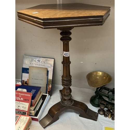 423 - A dark wood wine table with hexagonal top