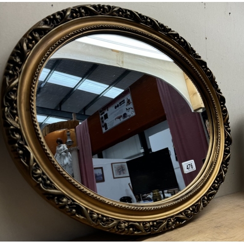 476 - A gilt framed oval mirror