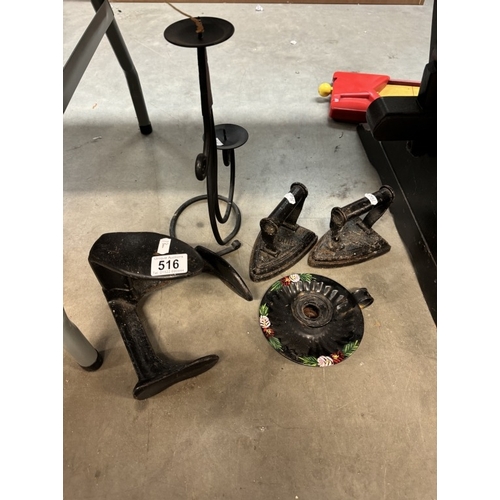 516 - A quantity of cast iron items including Lasts, Irons, candle stand etc