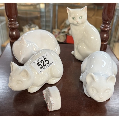 525 - A quantity of cat figures & an outdoor cat with solar panel