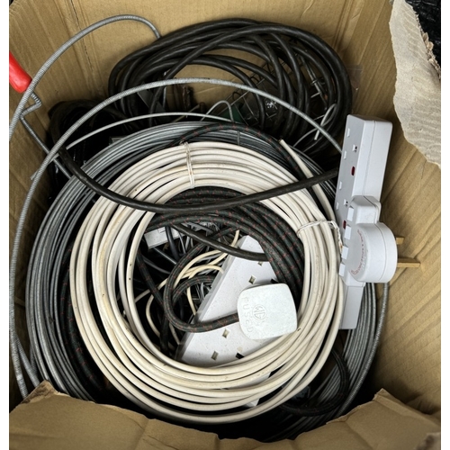 548 - A quantity of cables, electric sockets, guttering brackets etc