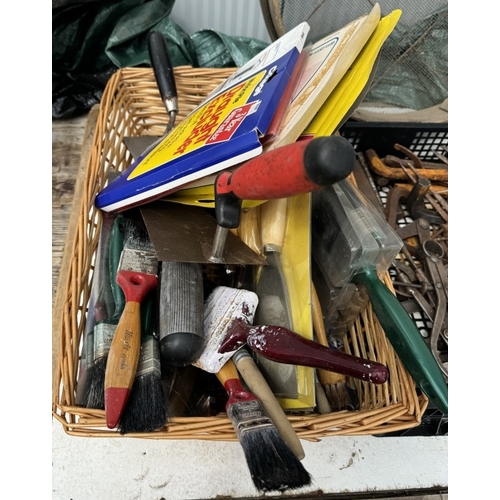 552 - A quantity of paint brushes, separators, pliers etc