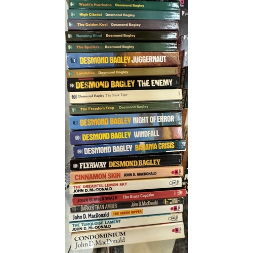 677 - A good lot of paperback books by Travis McGee, John D.Mcdonald, Desmond Bagley, Mickey Spillane & Du... 