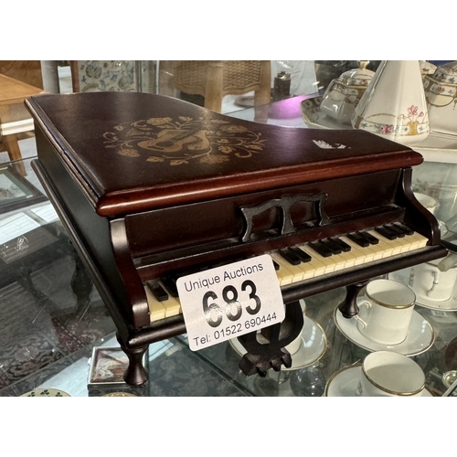 683 - A musical box in the shape of a piano which plays O Solo Mio