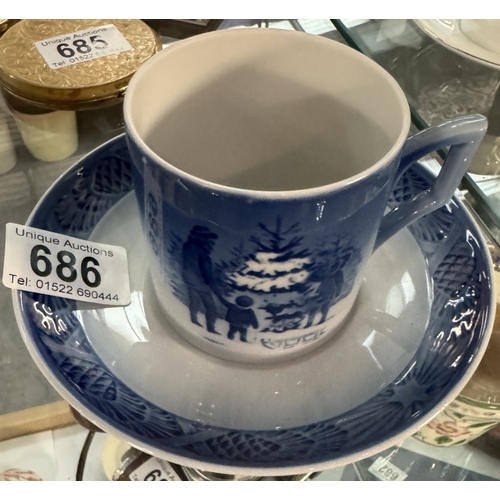 686 - A Royal Copenhagen coffee cup & saucer. Choosing the Christmas tree