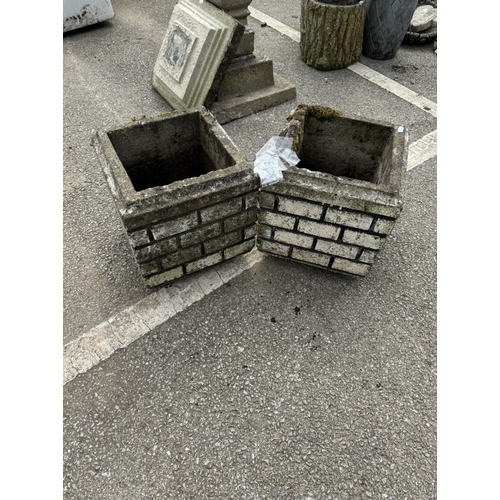 583 - A pair of square, brick effect concrete planters