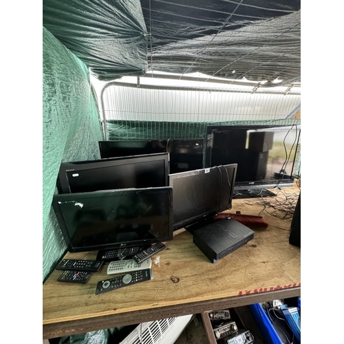 594 - A quantity of various size TV's, some with remotes