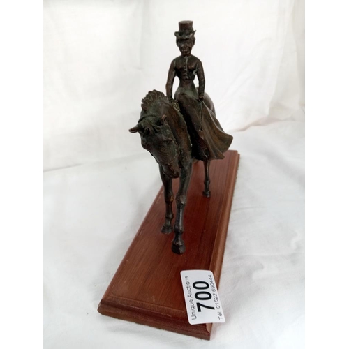 700 - A bronze Edwardian dressed lady on horse