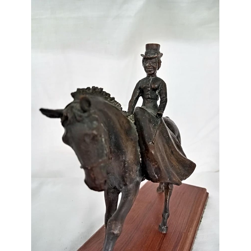 700 - A bronze Edwardian dressed lady on horse