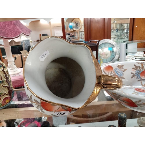 705 - A peach decorative jug & wash bowl