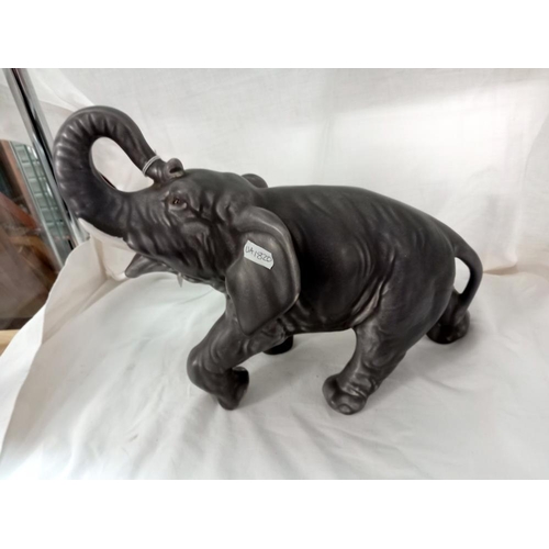 710 - A large unbranded pottery elephant