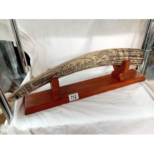 712 - A large ornamental replica scrimshaw tusk on stand