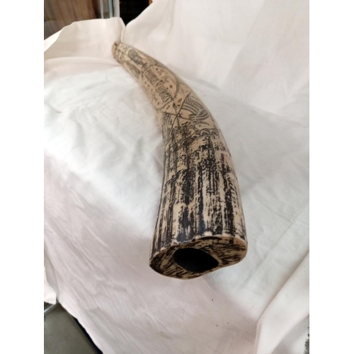 712 - A large ornamental replica scrimshaw tusk on stand