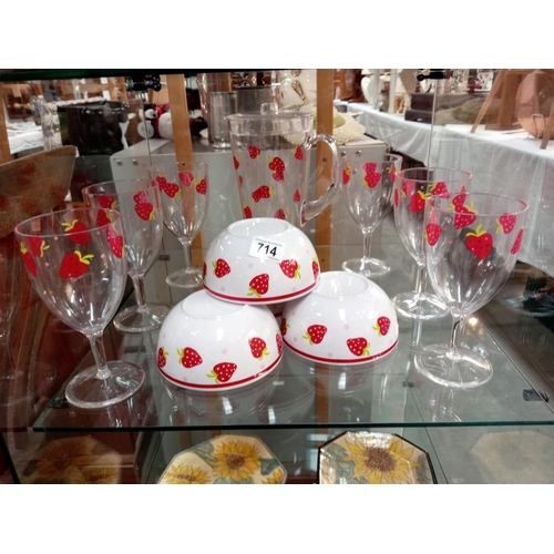 714 - A plastic strawberry pattern, drinks glasses, jug & 4 cereal bowls