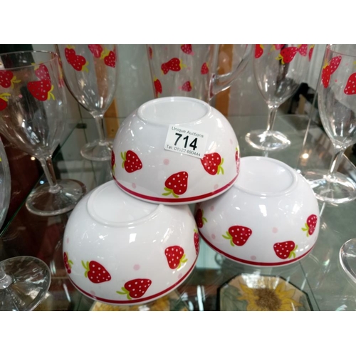 714 - A plastic strawberry pattern, drinks glasses, jug & 4 cereal bowls