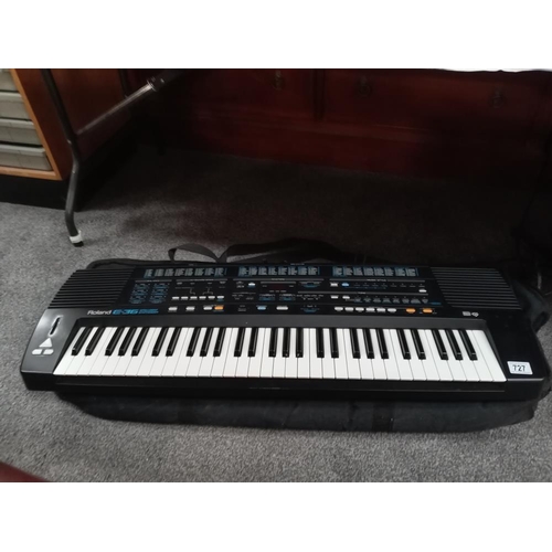 727 - A 'Roland' E36 intelligent synthesizer including power unit & carrying bag