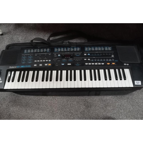 727 - A 'Roland' E36 intelligent synthesizer including power unit & carrying bag