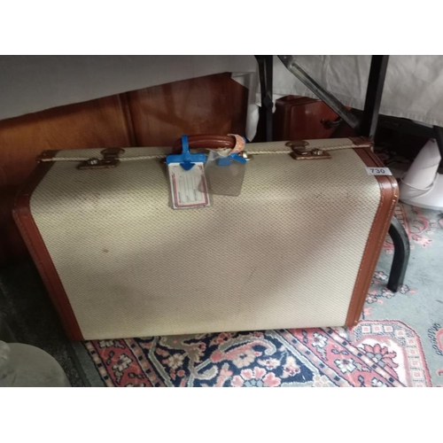 730 - A vintage suitcase