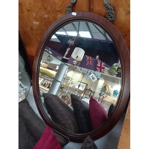 740 - An oval mahogany framed mirror