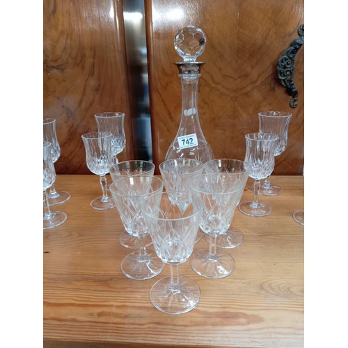 742 - A glass decanter with silver plated neck & a selection of glasses