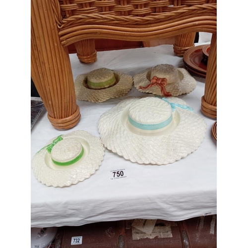 750 - 4 pottery wall display bonnets, 1 marked Falcon ware, pink and small green chipped underneath