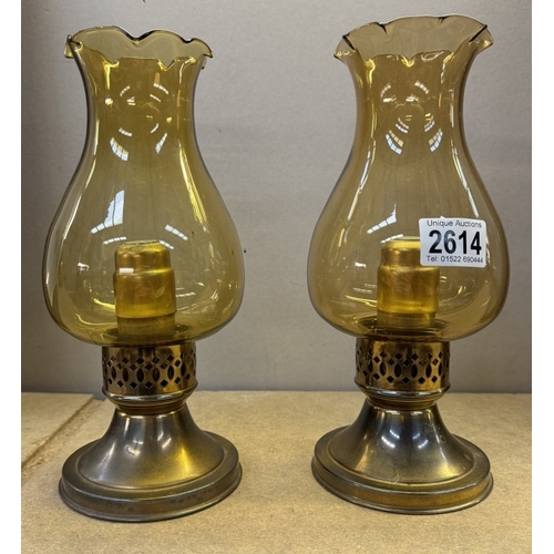 2614 - A pair candle of lamps. Height 26cm