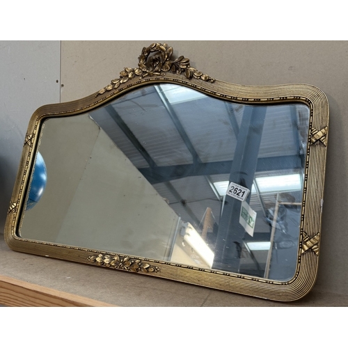 2621 - An ornate arch-topped gilt framed mirror (73 x 50cm approximately)