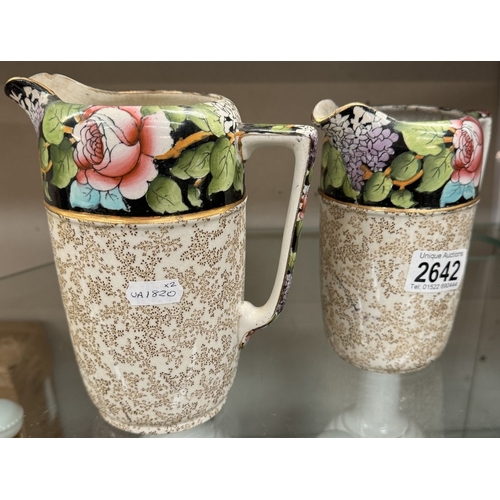 2642 - A pair of Winton floral jugs