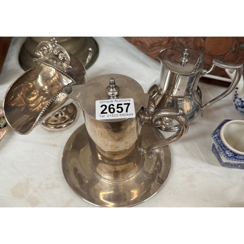 2657 - 3 Items of silver plate including 2 Jugs & a sugar scuttle