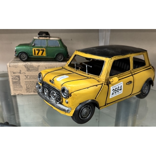 2664 - A boxed resin Shudehill racing mini & a large pressed steel mini