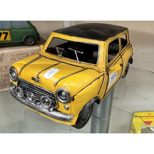 2664 - A boxed resin Shudehill racing mini & a large pressed steel mini